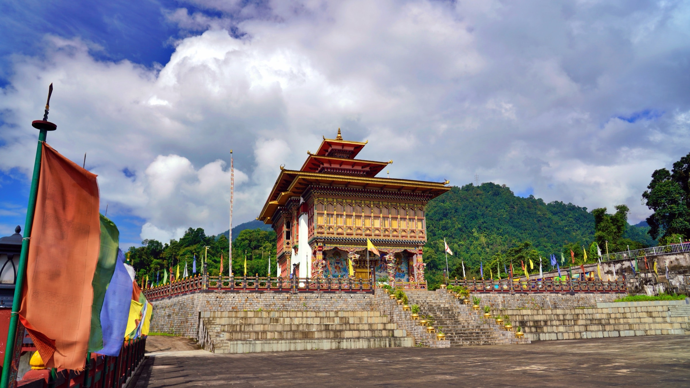 A Bhutanese temple with traditional prayer flags in Gelephu Mindfulness City